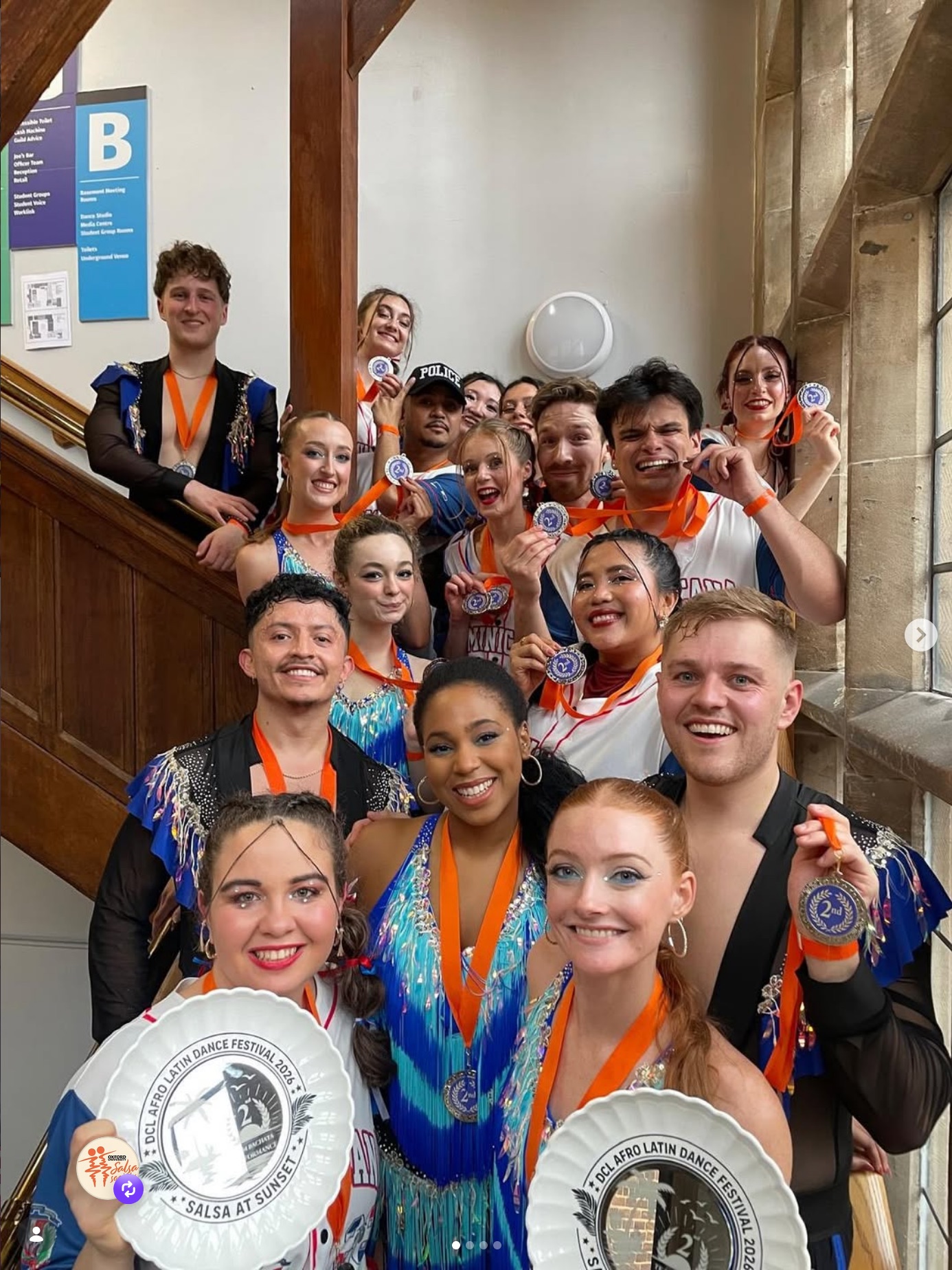 Bachata and Intermediate Salsa teams holding silver medals from DCL 2026